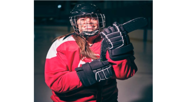 a girl in fully accessorized hockey jersey wear